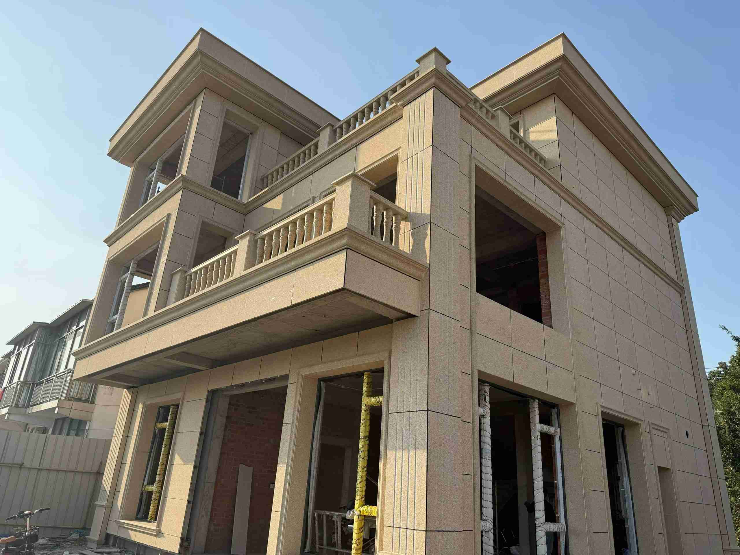 湖州 黄金麻花岗岩石材荔枝面外墙干挂效果展示